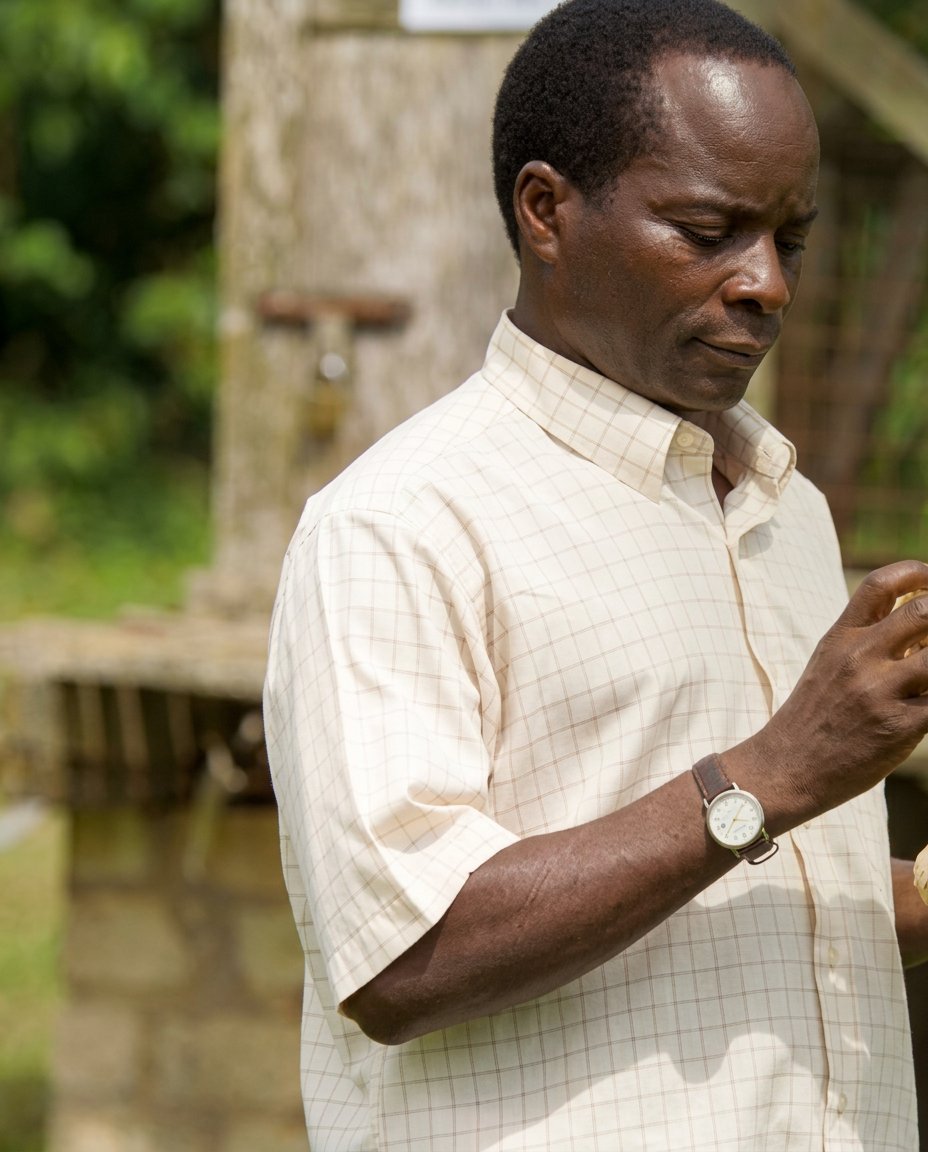 Researcher with maize, Uganda