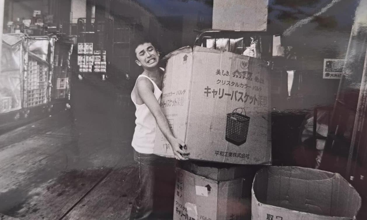 Carrying boxes in a Tokyo street market