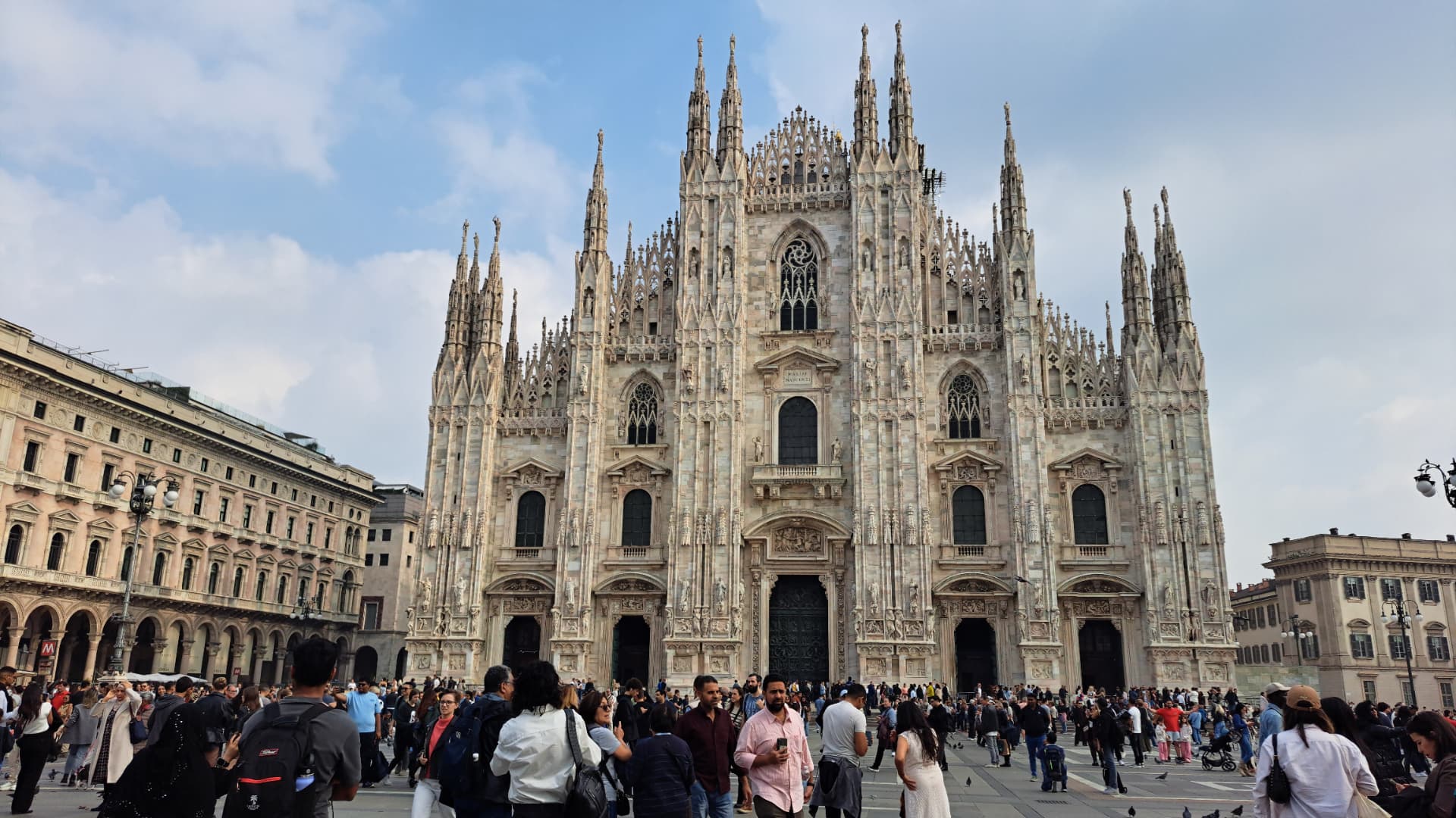 The Duomo in Milan seen across a busy square